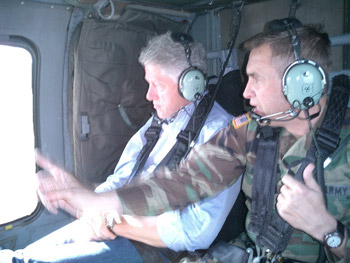 President Clinton surveys the once war-torn land on his way to Camp Bondsteel, Kosovo. September 19, 2003